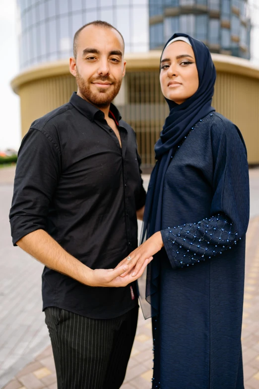 a beautiful couple smiling and holding hands