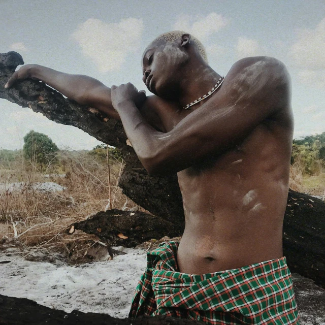 man with  on standing near a tree