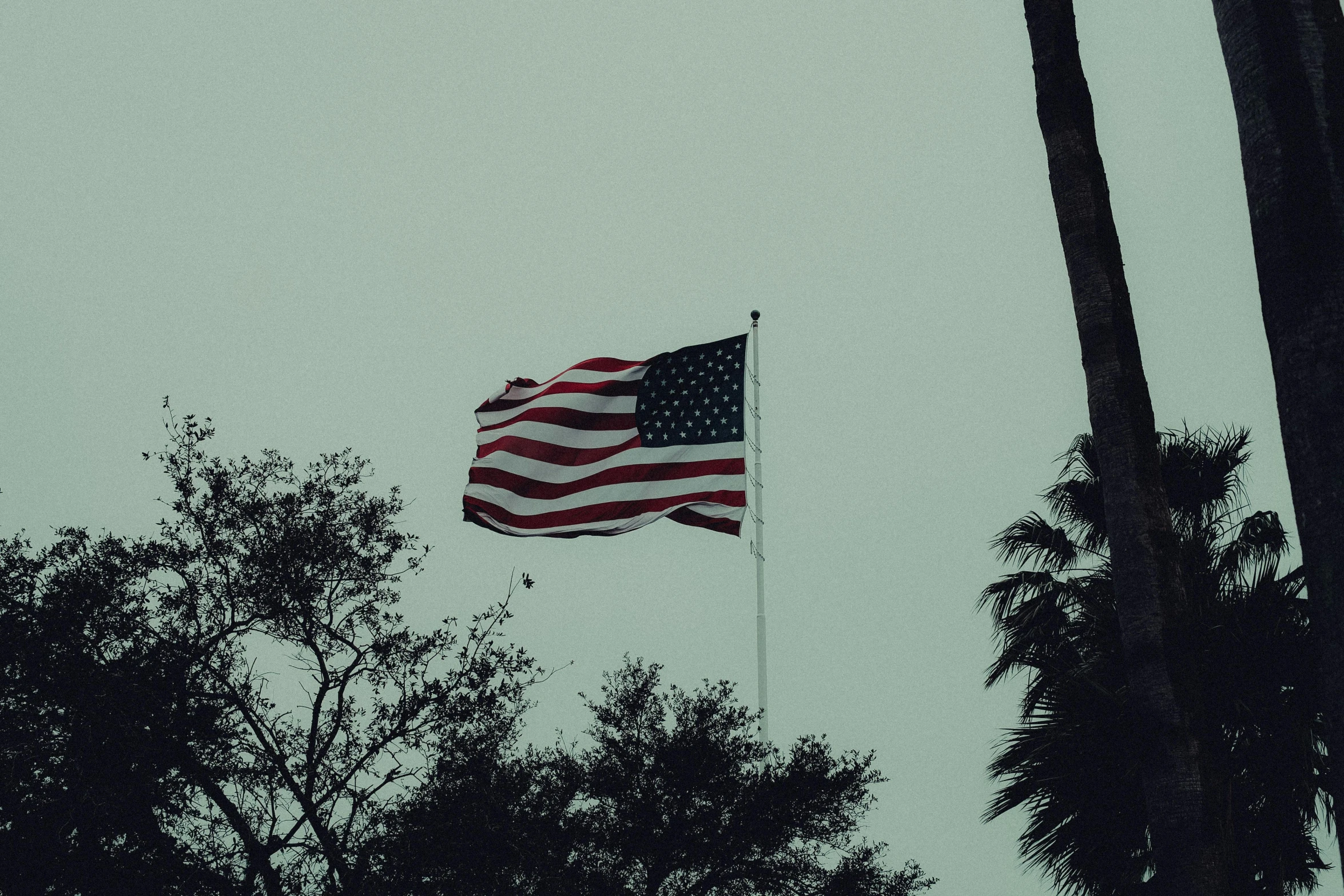 an american flag waving in the wind