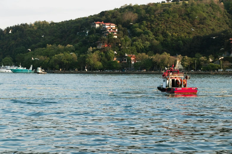 the boat is traveling on the blue water