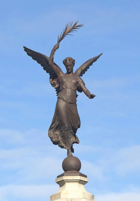 the statue is sitting on top of a pedestal