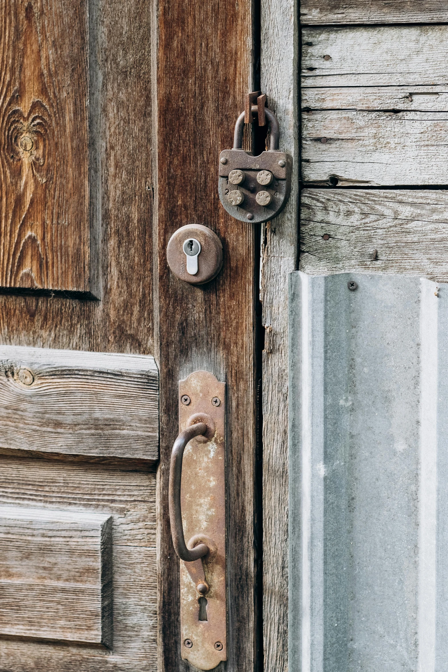 the door is open and shows a wooden door with a pad