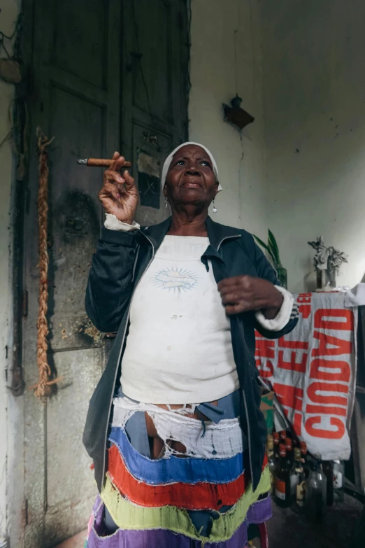 a woman smoking a cigarette in her room