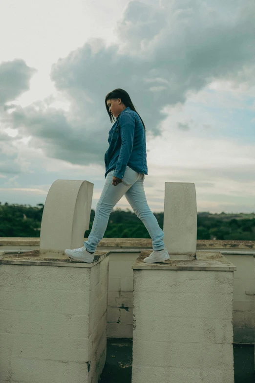 a person standing on some concrete type blocks