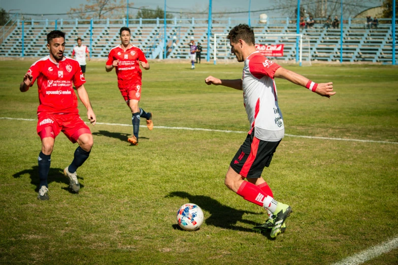 a group of men playing a game of soccer