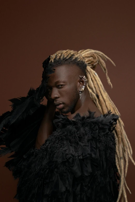 a man with dreadlocks and long blond hair