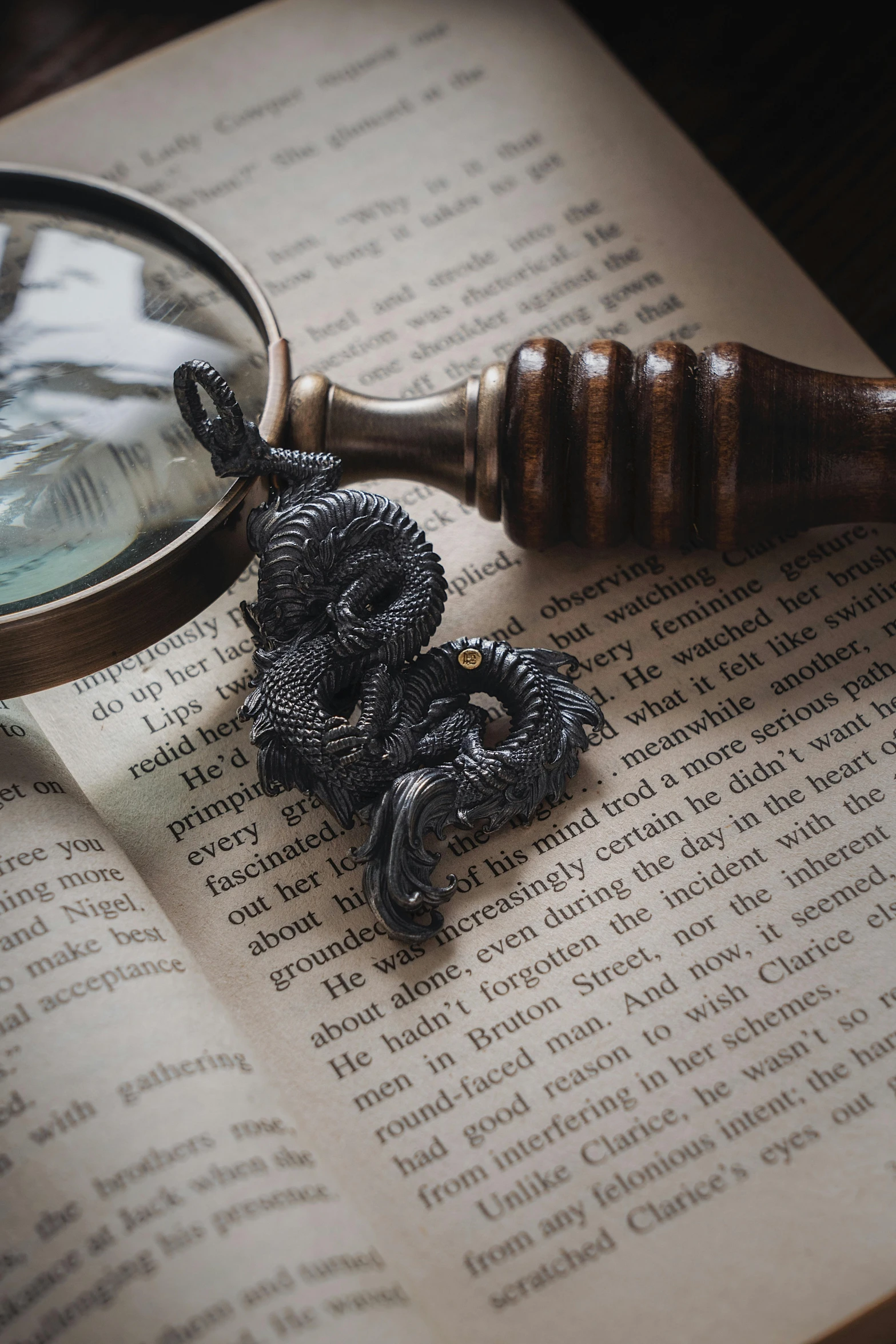 a magnifying glass sitting on top of an open book