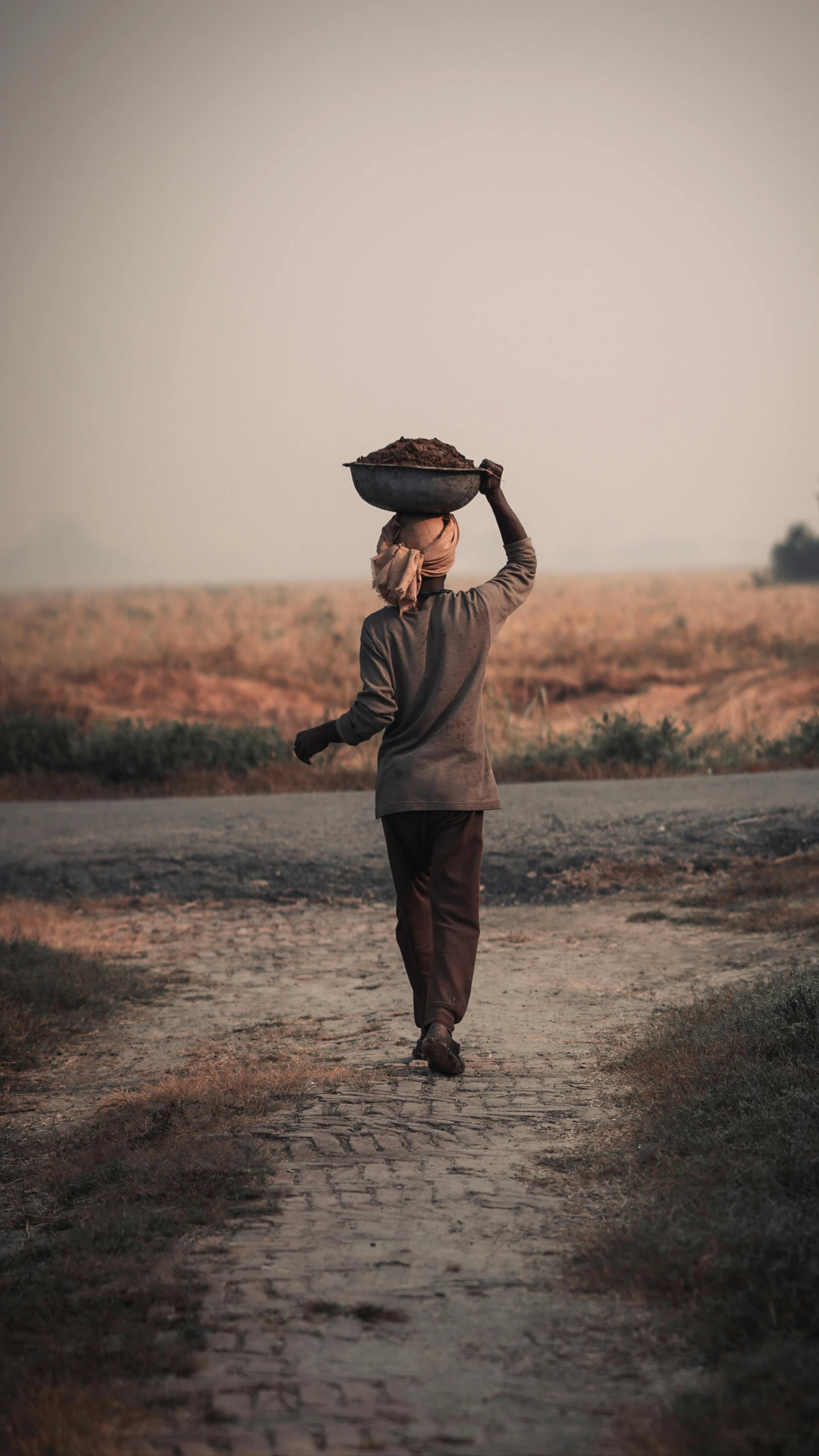 a woman walking through the rain on a cell phone