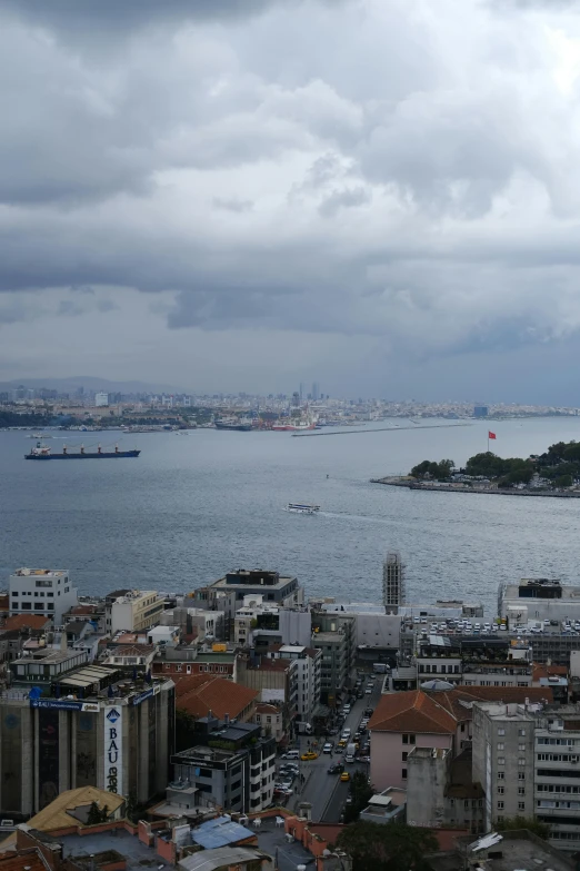 the city has large buildings and large boats on the water