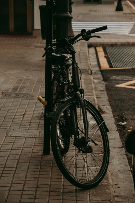 a bike parked next to a telephone pole