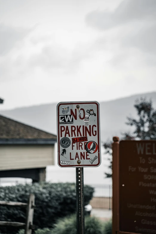 this parking sign indicates that there is no parking in the lane