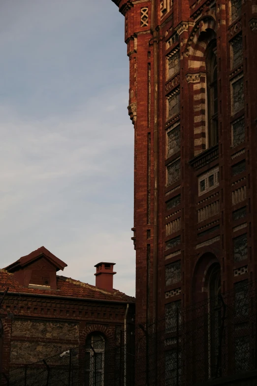 an old building and a clock tower against a blue sky