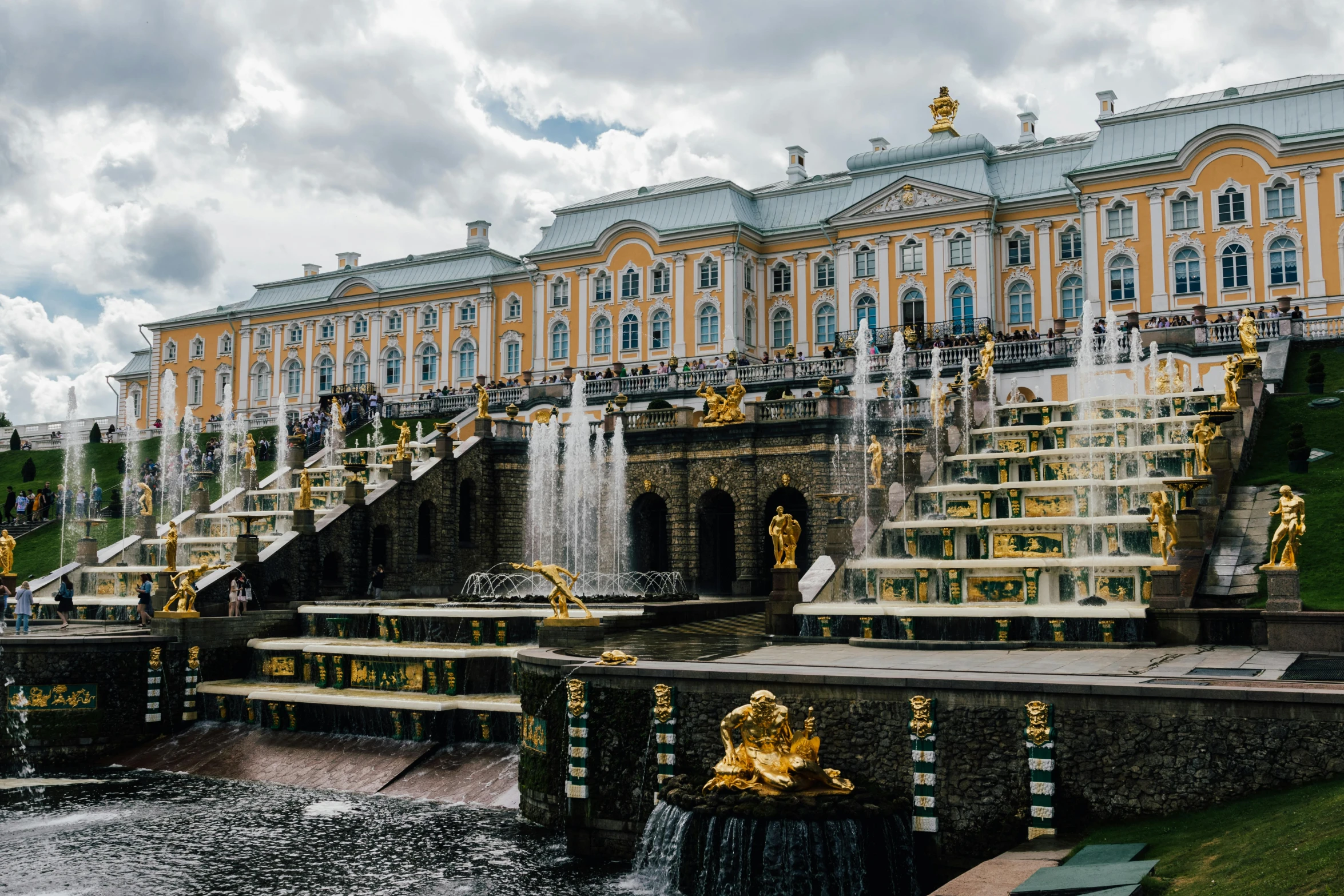 a large building in a park and fountain