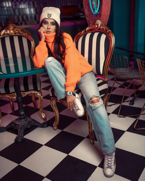 a woman sitting on top of a wooden chair