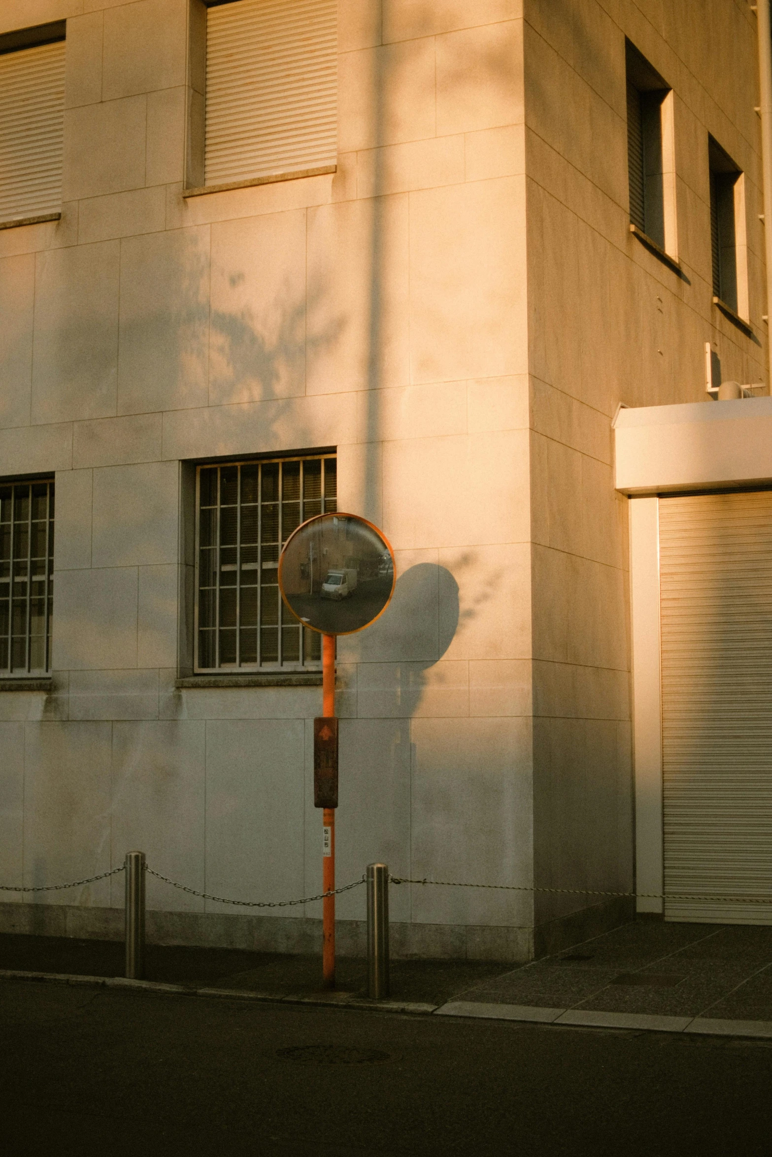 an old fire hydrant on the street next to a building