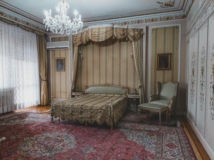 the interior of a lavish bedroom with a large chandelier