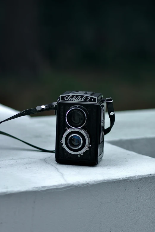 an old camera with a pair of scissors on it