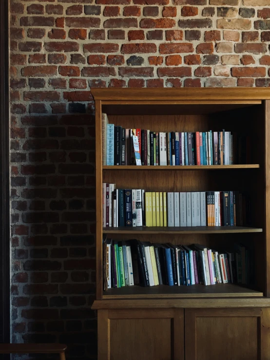 there is an open bookshelf with several books in it