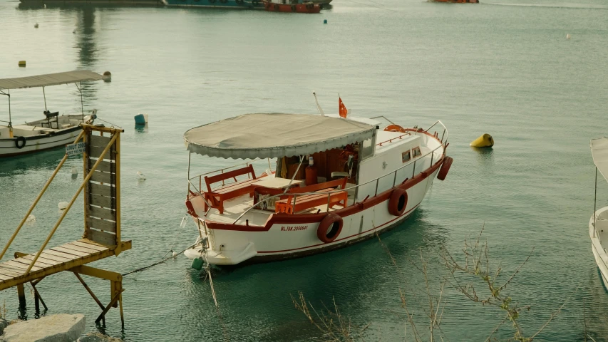 several boats in a bay with clear blue water