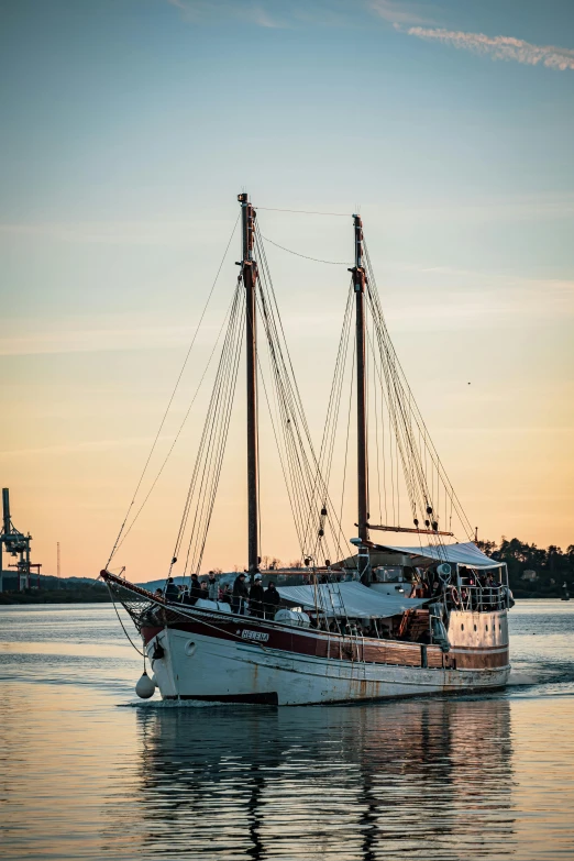 a sailboat is sailing in calm waters