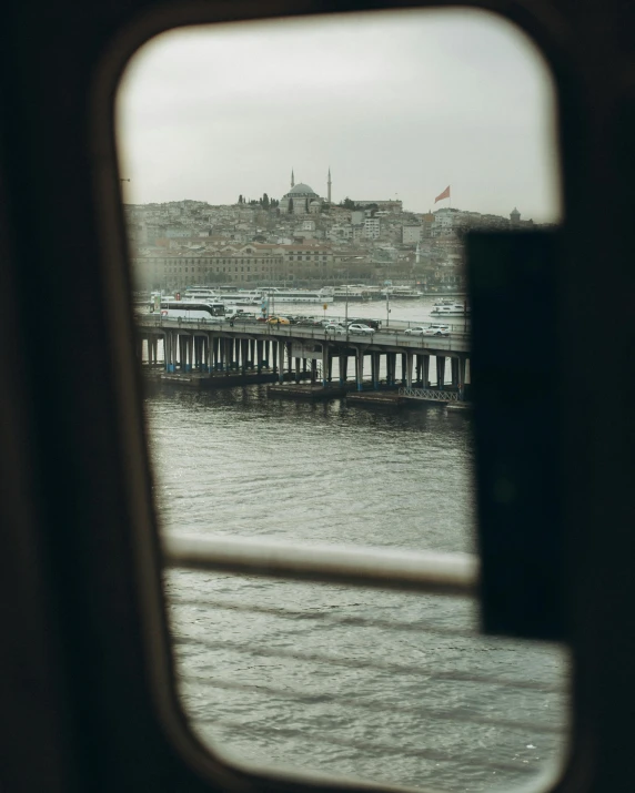 the view out the window of a bus shows water