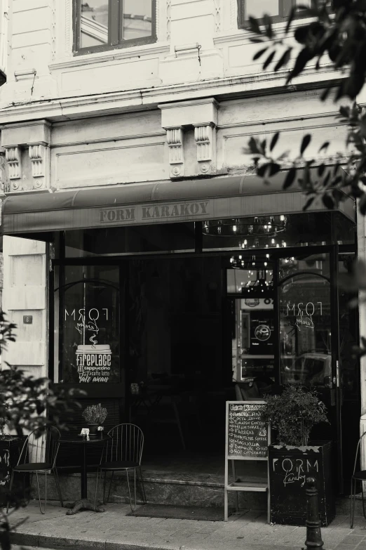 an old po of a restaurant on a corner