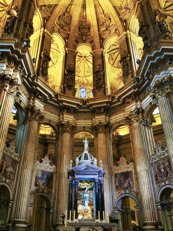 the altar of a beautiful church with gold and blue decorations