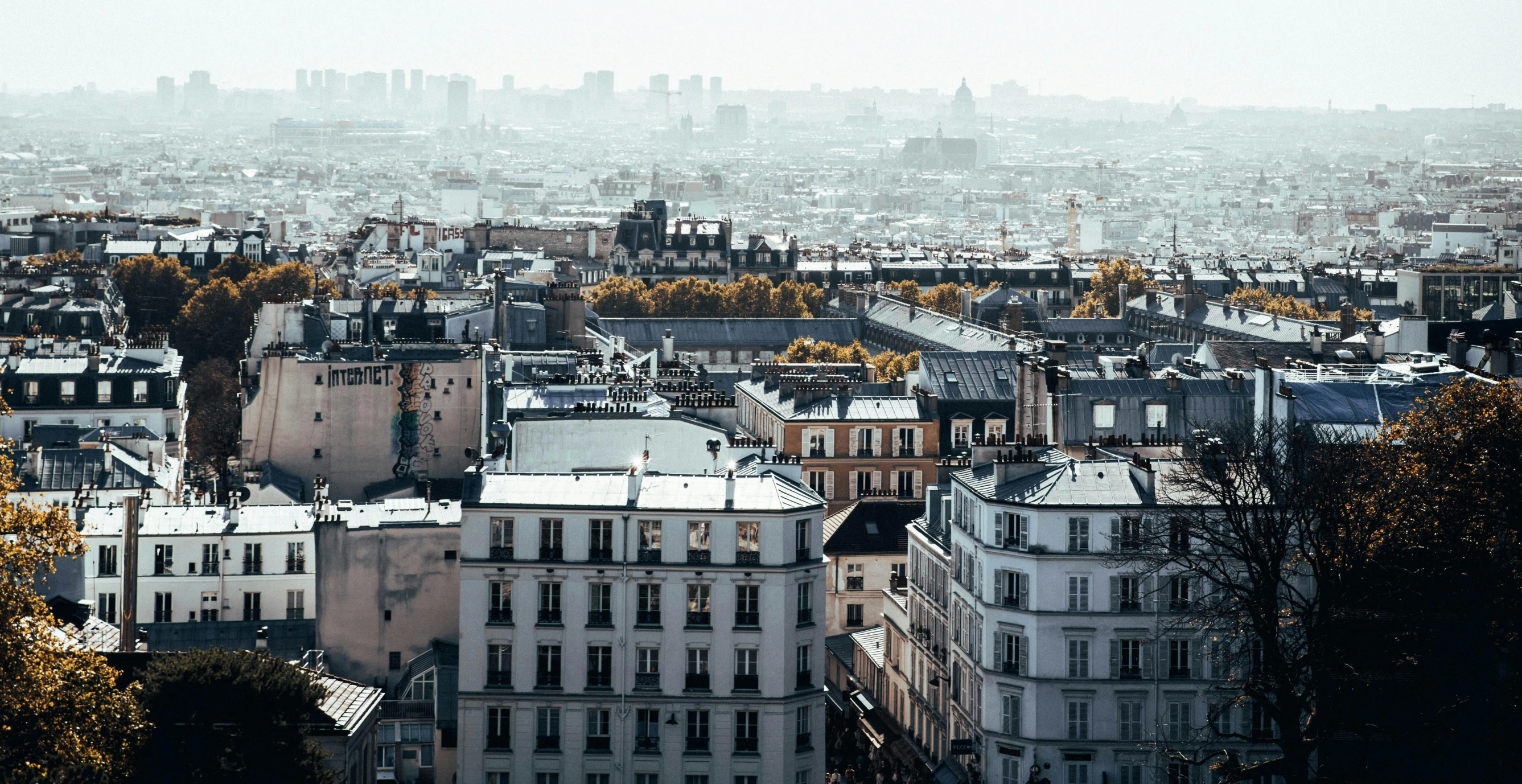 a cityscape in paris, france with many buildings and tall skyscrs