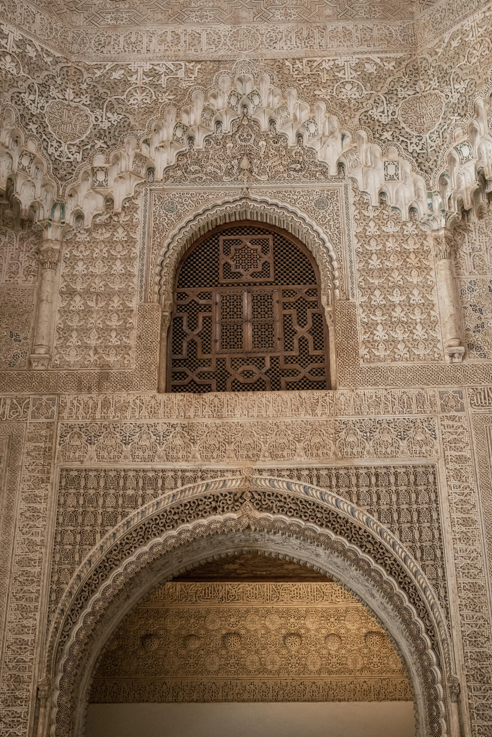 a gate in an ornate building with carvings on it