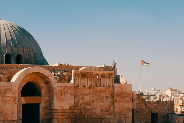 an old city with two domes and a building