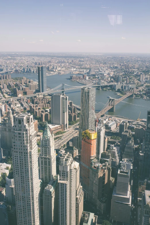 a large city with tall buildings along the river