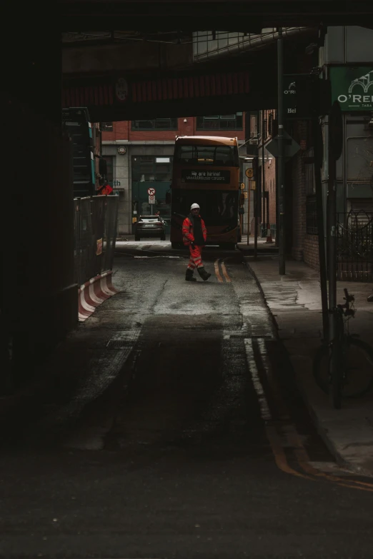 the man is walking down the street alone