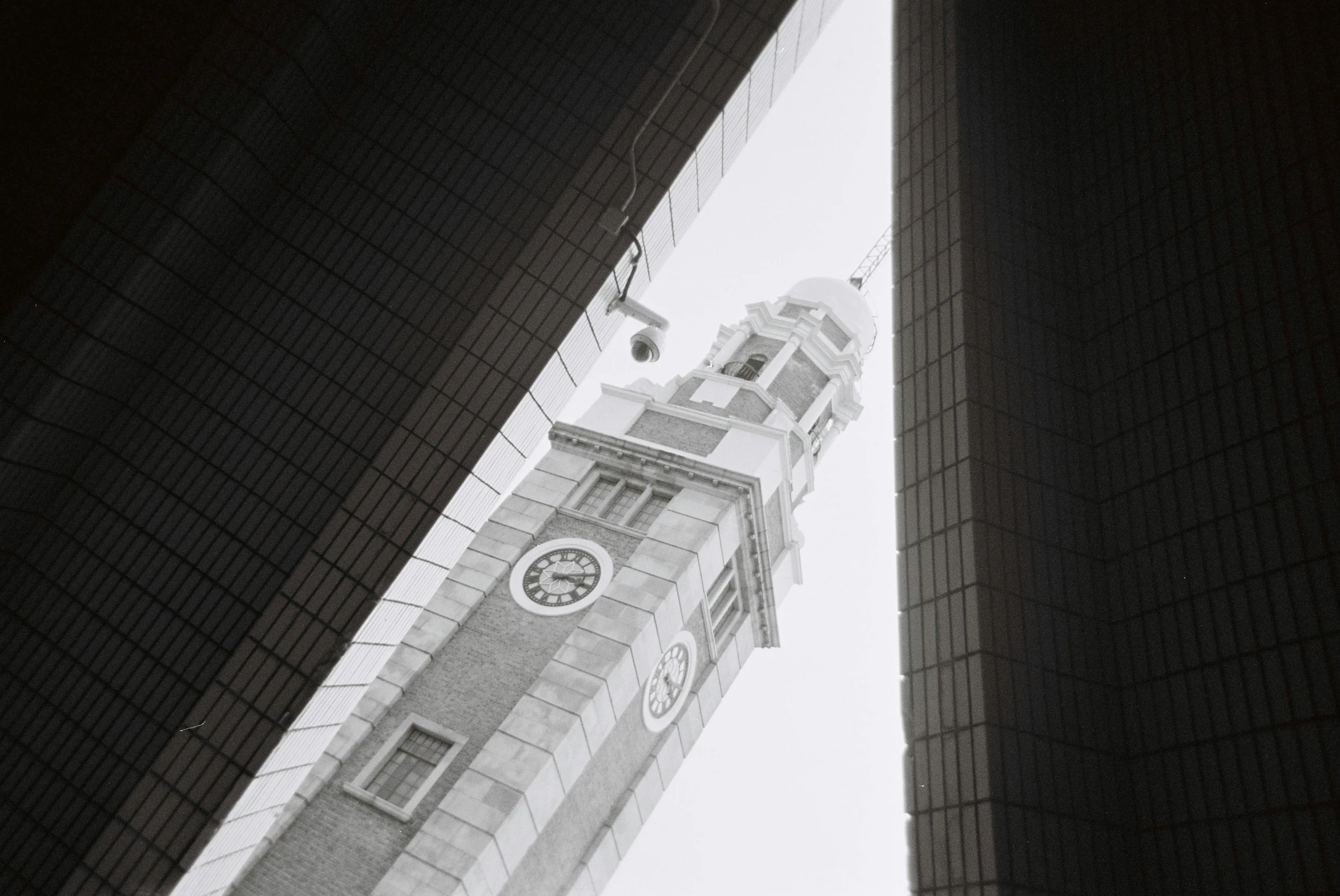 a clock tower sitting in the middle of the city