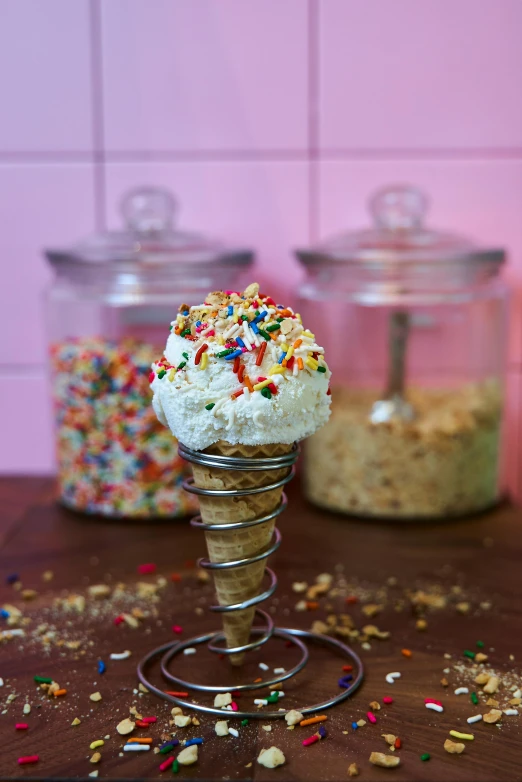 two jars with sprinkles on a table