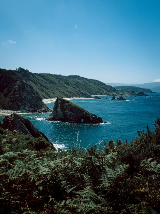 the coast and beach are clear blue water