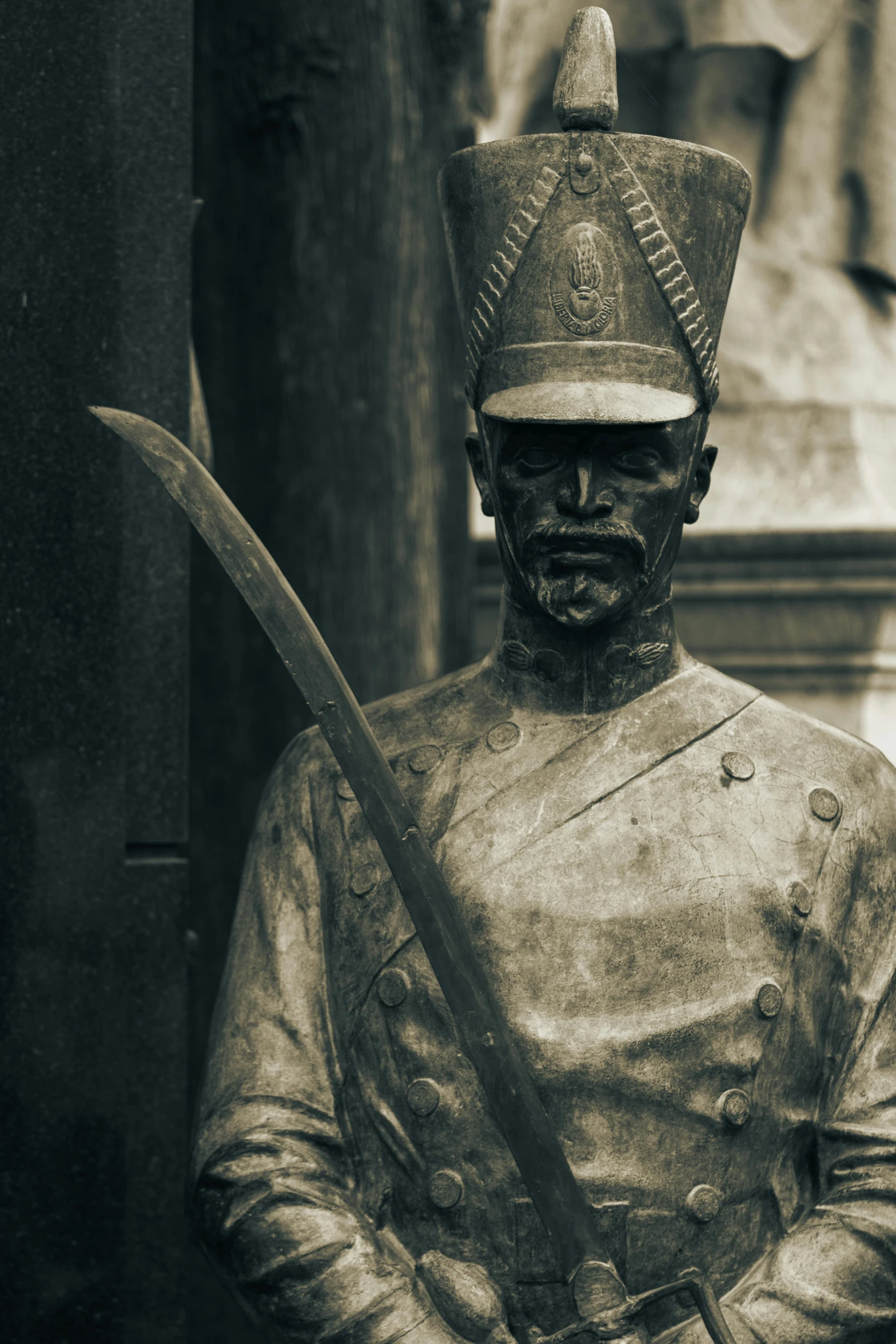 a statue of a soldier holding a knife in a museum