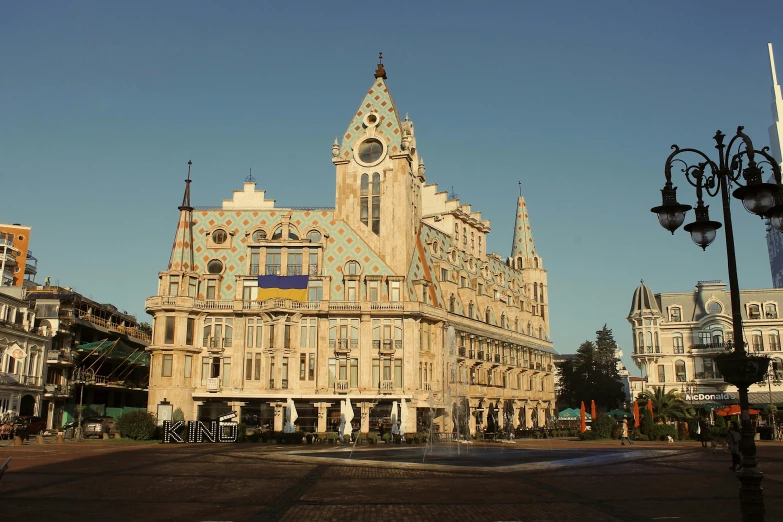 a picture of an old building with the steeple of the building and large clock