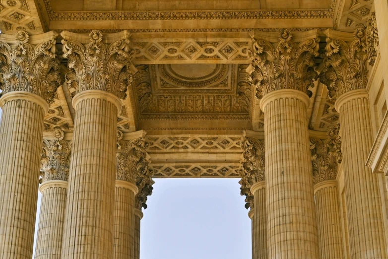 columns with carving work above the top of a building