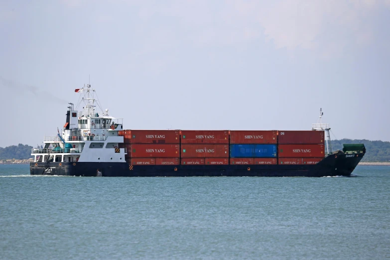 a large cargo ship in the middle of an ocean