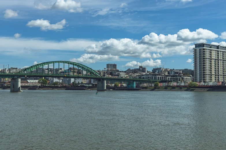 a large bridge is spanning the width of a body of water