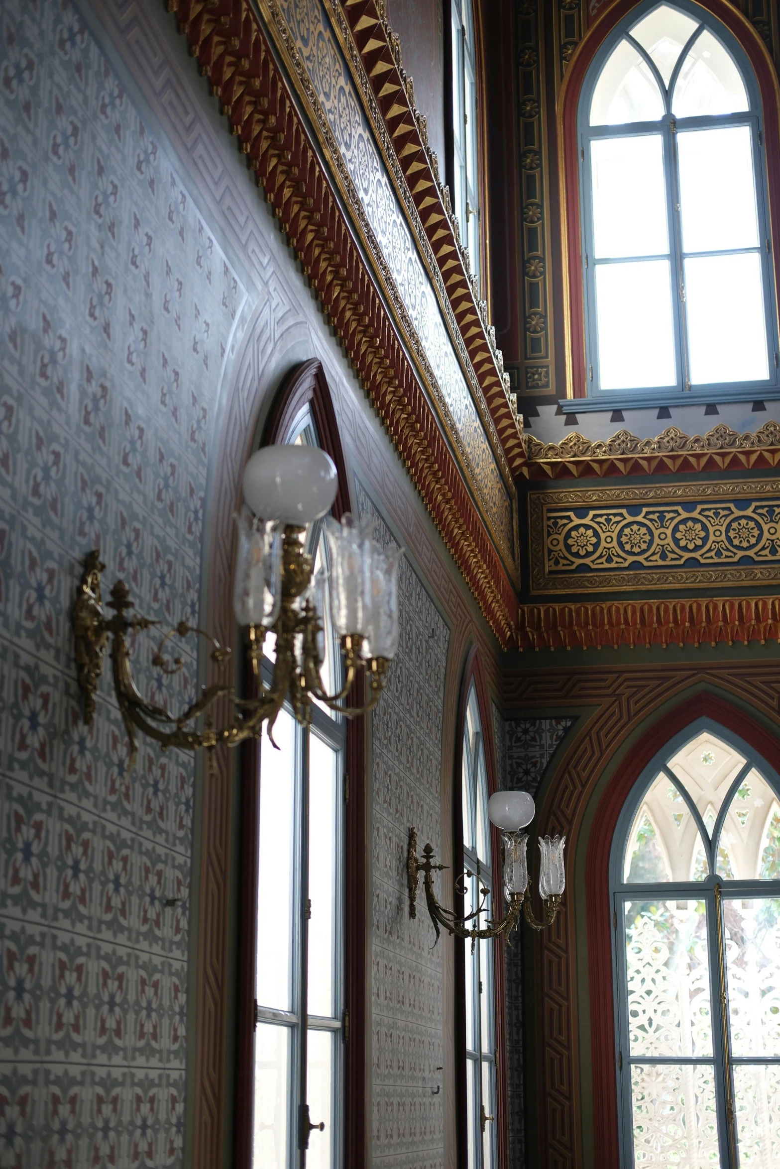 a hallway with multiple windows and a light fixture