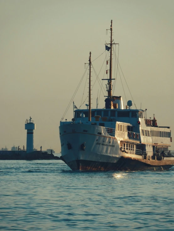 a boat sails across a calm body of water