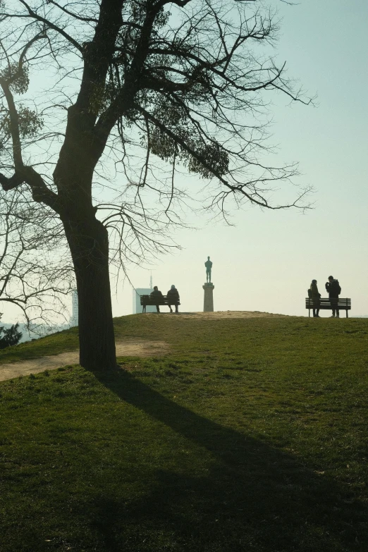 a park with a bench that has benches near by