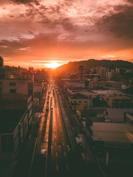 sunset with a train station and train tracks in front