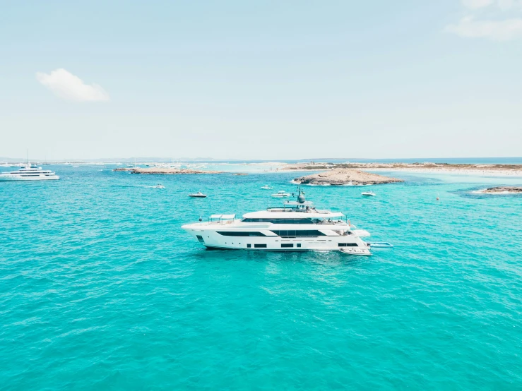 white boat with passengers sailing in the ocean