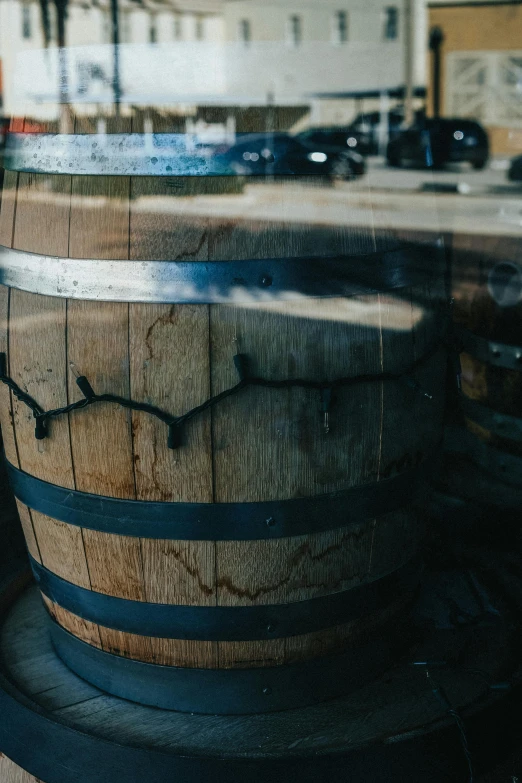 this image has a blurry picture of some barrels on the ground