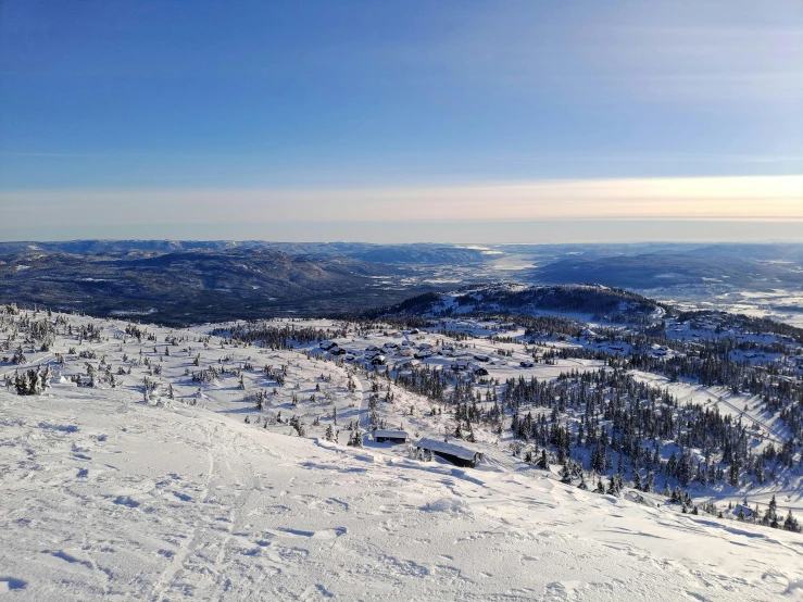 a person on skis and snowboards stands on a snowy slope