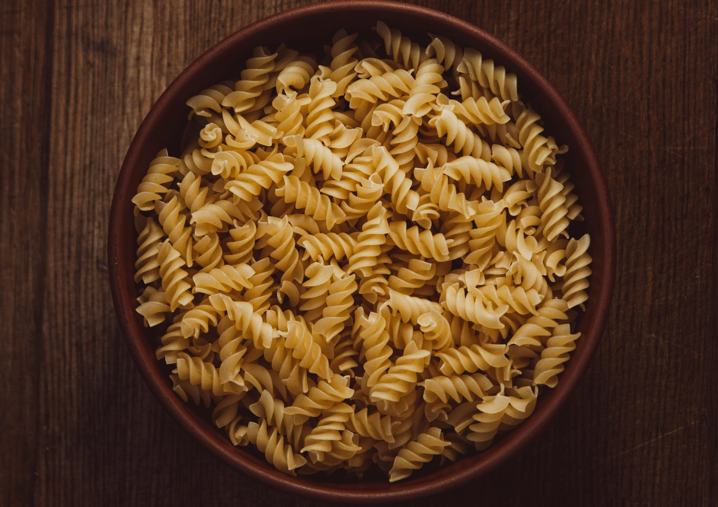 the small bowl contains four types of pasta