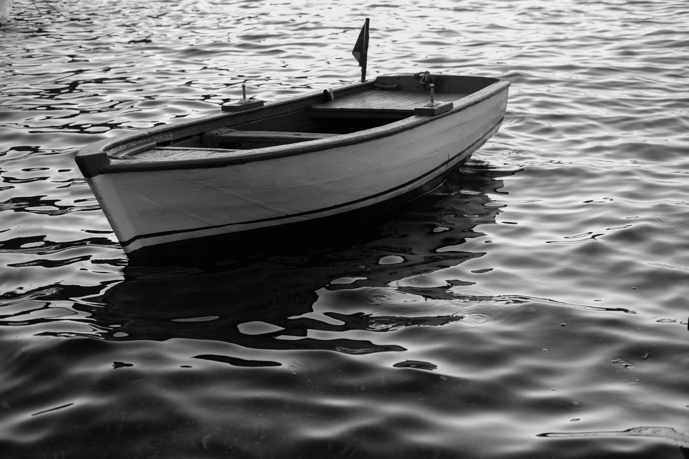 a boat in water on a sunny day