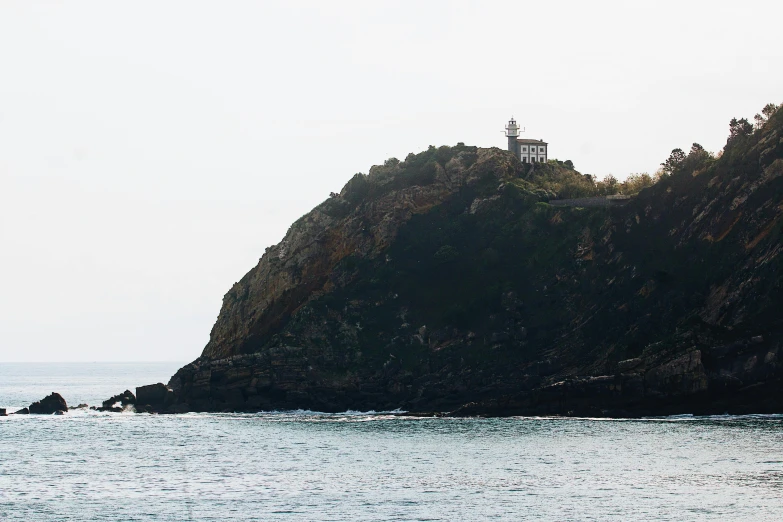 a ship is docked in front of an island